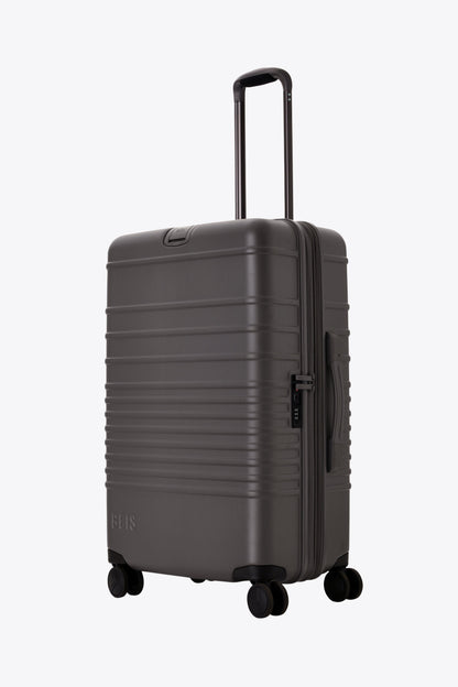 The Medium Check-In Roller in Charcoal