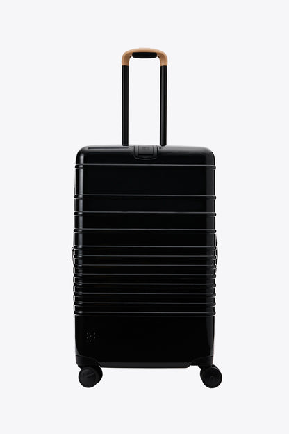 Resale The Medium Check-In Roller in Glossy Black
